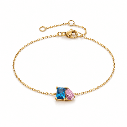 Three-quarter view of a blue and pink two-stone bracelet with gold-plated chain and lobster clasp