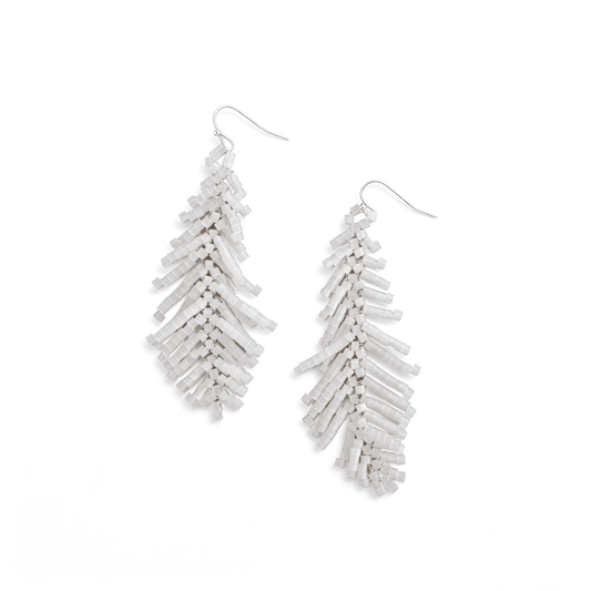 Pair of boho white beaded feather drop earrings in flat lay, showing the intricate hand-woven glass bugle bead leaf structure.