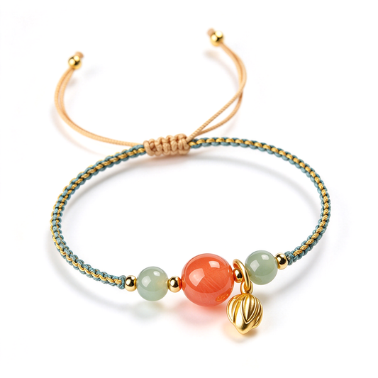 Braided bead charm bracelet displayed on a white background with a central orange bead and dangling charm.