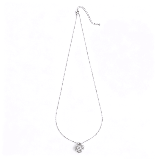 Complete studio view of the classic silver-plated love knot cz pendant necklace with an adjustable cable chain.