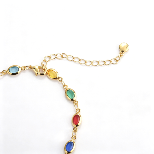 Full view of a multicolor oval chain bracelet with an adjustable extension chain