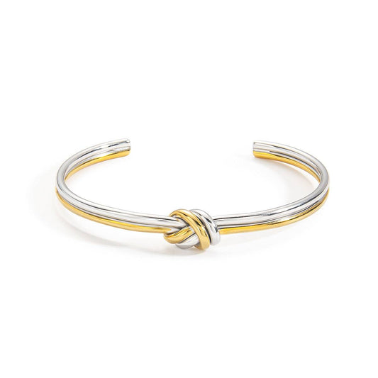 Mixed-metal double-strand knot cuff bracelet shown front-on against white