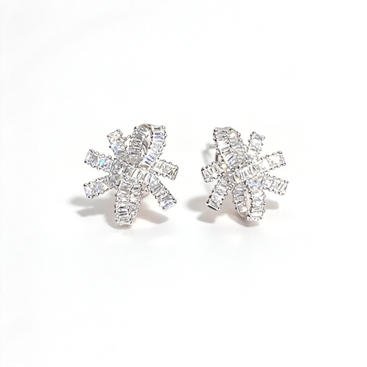 Silver-tone bow knot earrings shown as a matching pair from the front, highlighting their intricate layered design.