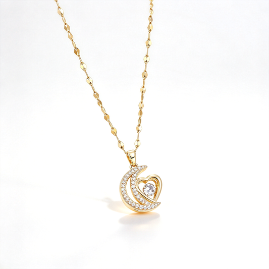Crescent moon and heart pendant necklace displayed on a white background, featuring a sparkling crescent design and central heart detail.