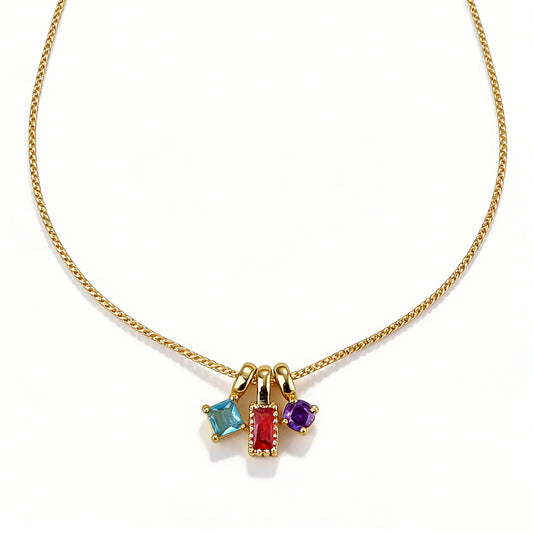 Ever P. gold pendant necklace with a geometric starburst design and colorful zirconia.