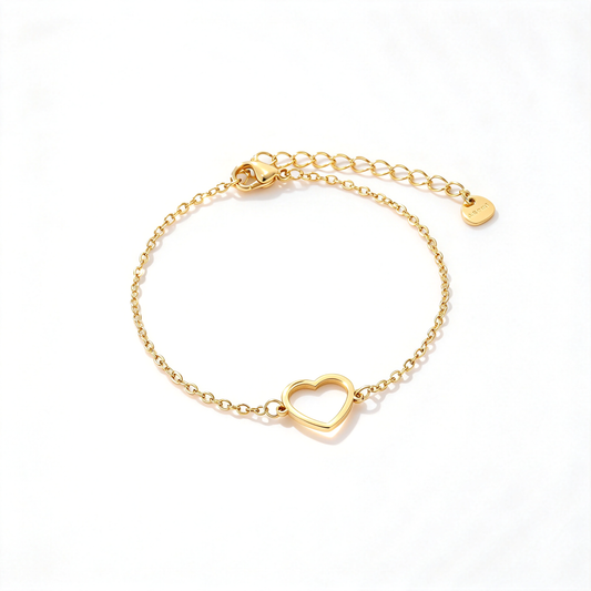 Gold heart charm chain bracelet arranged on a clean white background