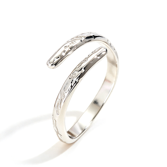 Silver-tone open ring featuring an uneven sculpted band and curved ends