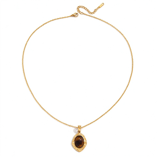 Full necklace arranged in an oval shape with the pendant, chain, clasp, and extension chain visible