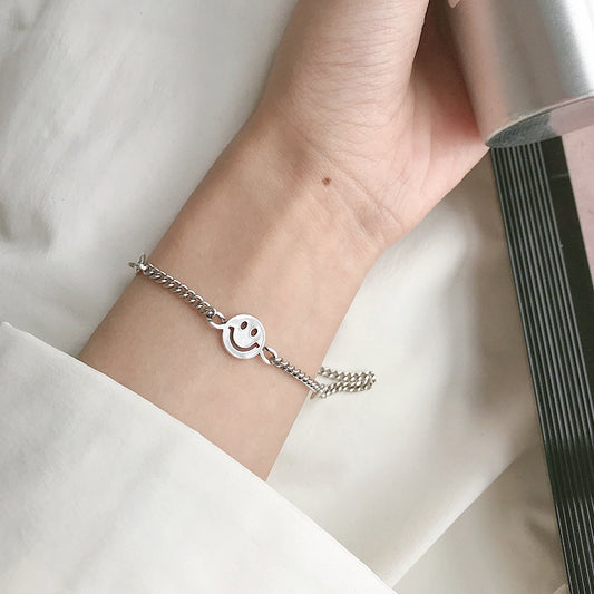 Close-up of the bracelet chain, lobster clasp, and adjustable extension chain on a white background.