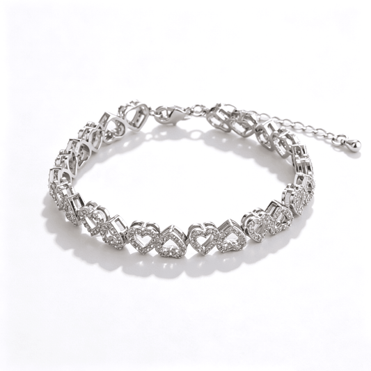 Ever P. heart bracelet featuring interlocking double heart links with full cubic zirconia stones.