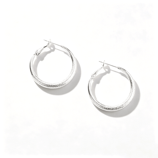 Ever P. minimalist silver jewelry collection featuring the large chunky tube hoop earrings.