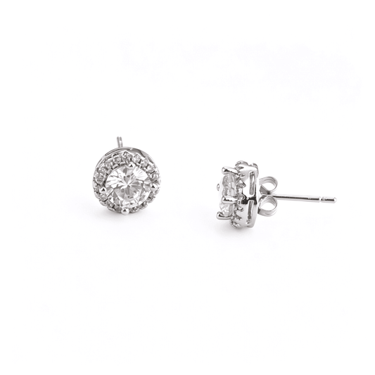 Front aesthetic shot of Ever P. square solitaire stud earrings, showing the brilliant round center stone.