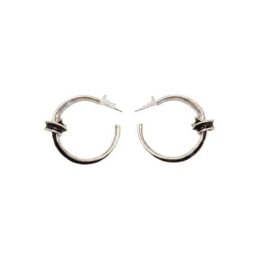 Ever P. vintage gold hoop earrings in an oversized, twisted chunky style.