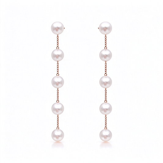 Five-pearl drop earrings arranged as a matching pair on a white background