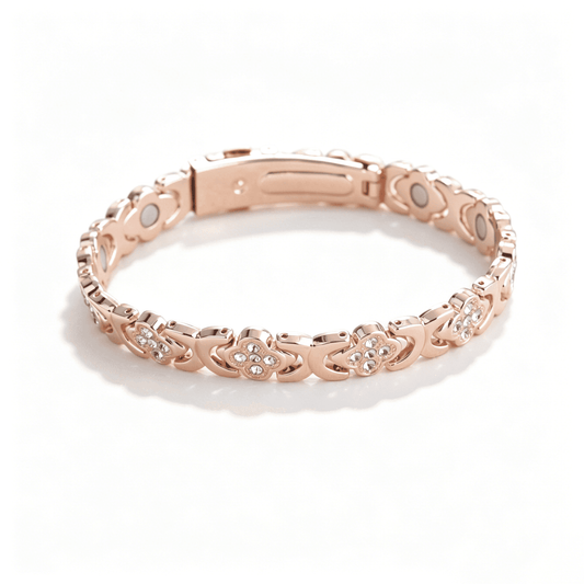 A rose gold four leaf clover bracelet featuring four interconnected hearts adorned with sparkling pave crystals.