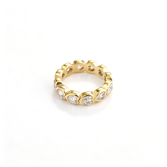 Heart band ring shown from an angled front view with repeating heart-shaped settings