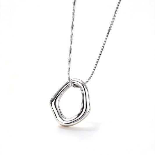 Silver-tone irregular geometric pendant necklace shown against a clean white background.