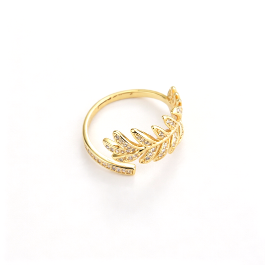 Open cuff ring shown from above, highlighting the curved band and leaf details
