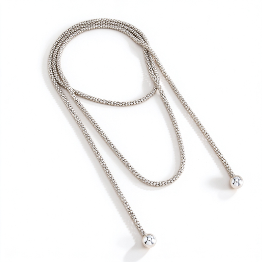 Long bead chain necklace with a draped design and rounded end details displayed on a white background