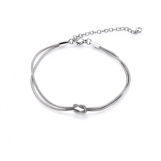 Silver love knot bracelet with a double-strand band displayed on a white background.