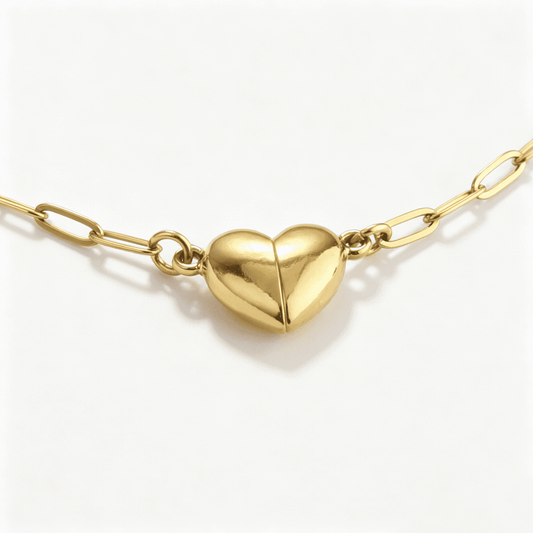 Frontal close-up of the fully connected magnetic gold heart, formed by matching necklaces for couples.