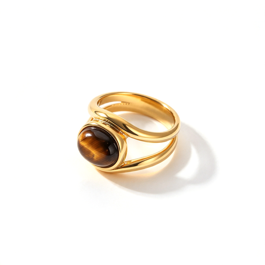 An oval centerpiece open band statement ring shown alone in a three-quarter product view.