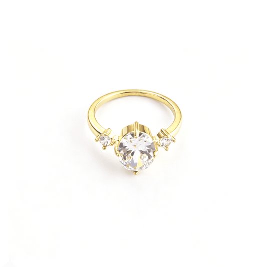 Top detailed view of Ever P. vintage engagement style gold-plated ring with shimmering oval and round cz stones.
