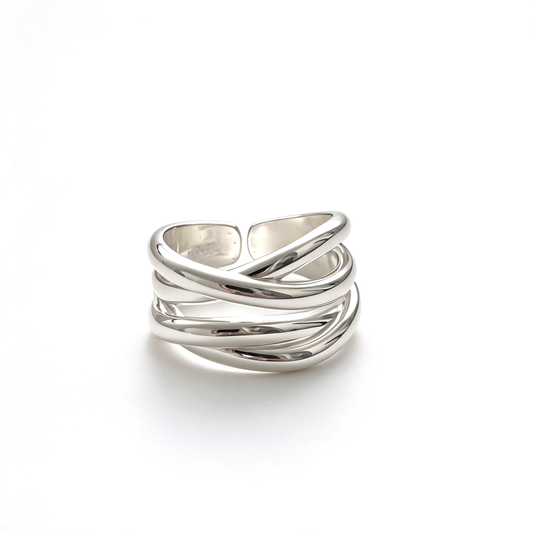 Gold-tone sculptural crossover ring with interwoven bands shown on a white background