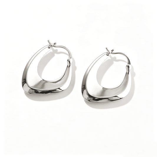 Ever P. minimalist cross hoop earrings, the perfect silver accessory for everyday elegance.