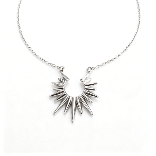 Direct front view of the polished stainless steel sunburst spike pendant necklace.