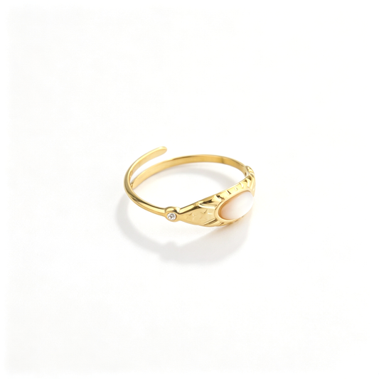 Angled view showcasing the sunburst-engraved gold band and bezel-set marquise opaline stone with CZ studs.