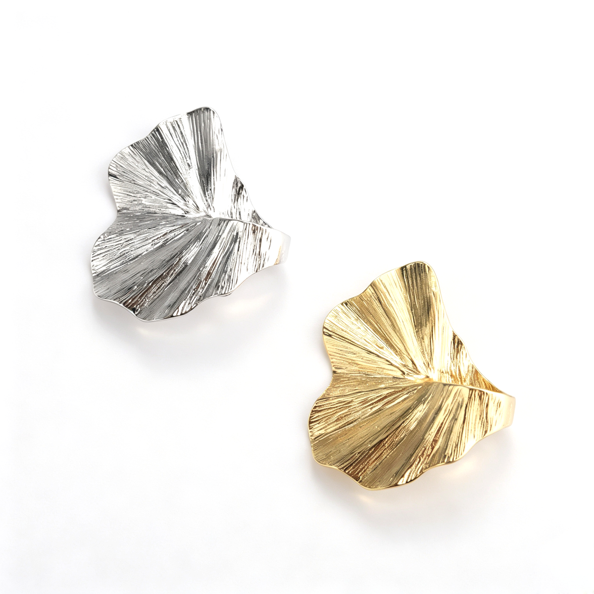 Overhead layout shot of the 18k gold-plated irregular pleated leaf statement ring on white background.