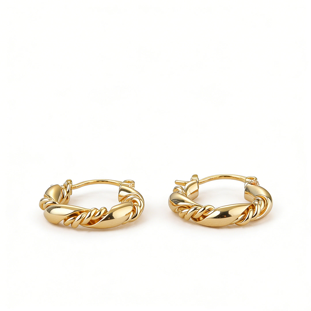 High-quality 18k gold earrings in a twisted hoop design, perfect for a modern geometric look.