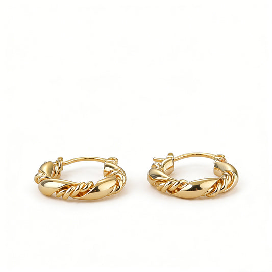High-quality 18k gold earrings in a twisted hoop design, perfect for a modern geometric look.