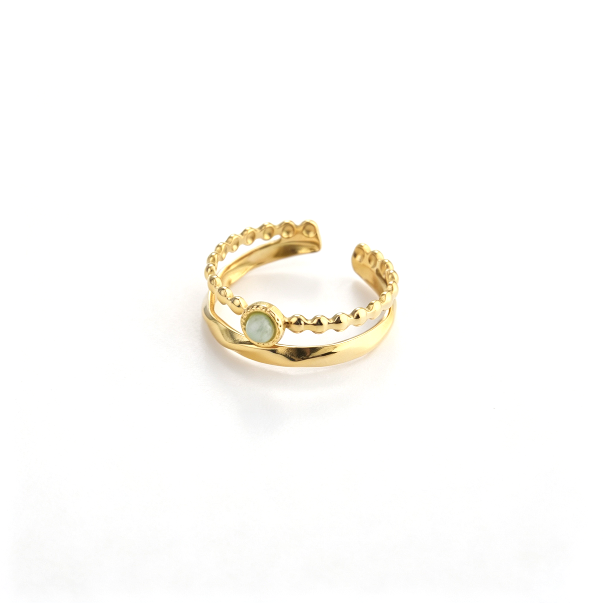 Angled view of an 18k gold-plated open ring featuring a beaded band set with a natural green crystal stone.