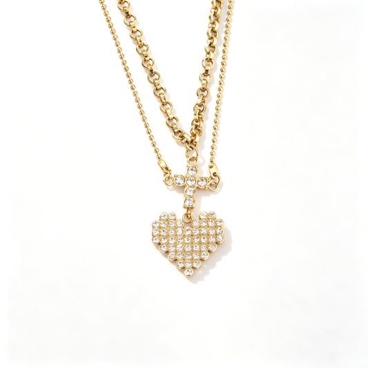 Frontal view showcasing the connected crystal cross connector and sparkling heart pendant layout.