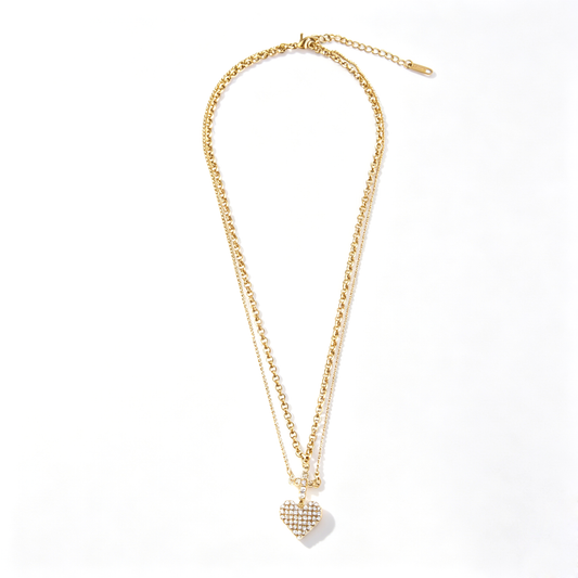 Full layout shot of the 18k gold-plated stainless steel layered cross and heart pendant necklace.