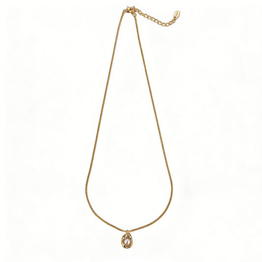 Close-up of an 18k gold plated necklace with lustrous natural freshwater pearls.