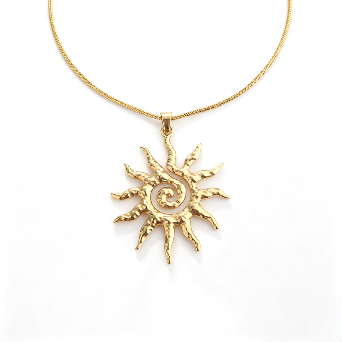 Direct frontal detail view of the openwork spiral sunburst pendant with hammered solar rays.