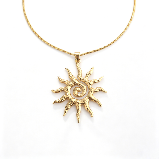 Direct frontal detail view of the openwork spiral sunburst pendant with hammered solar rays.