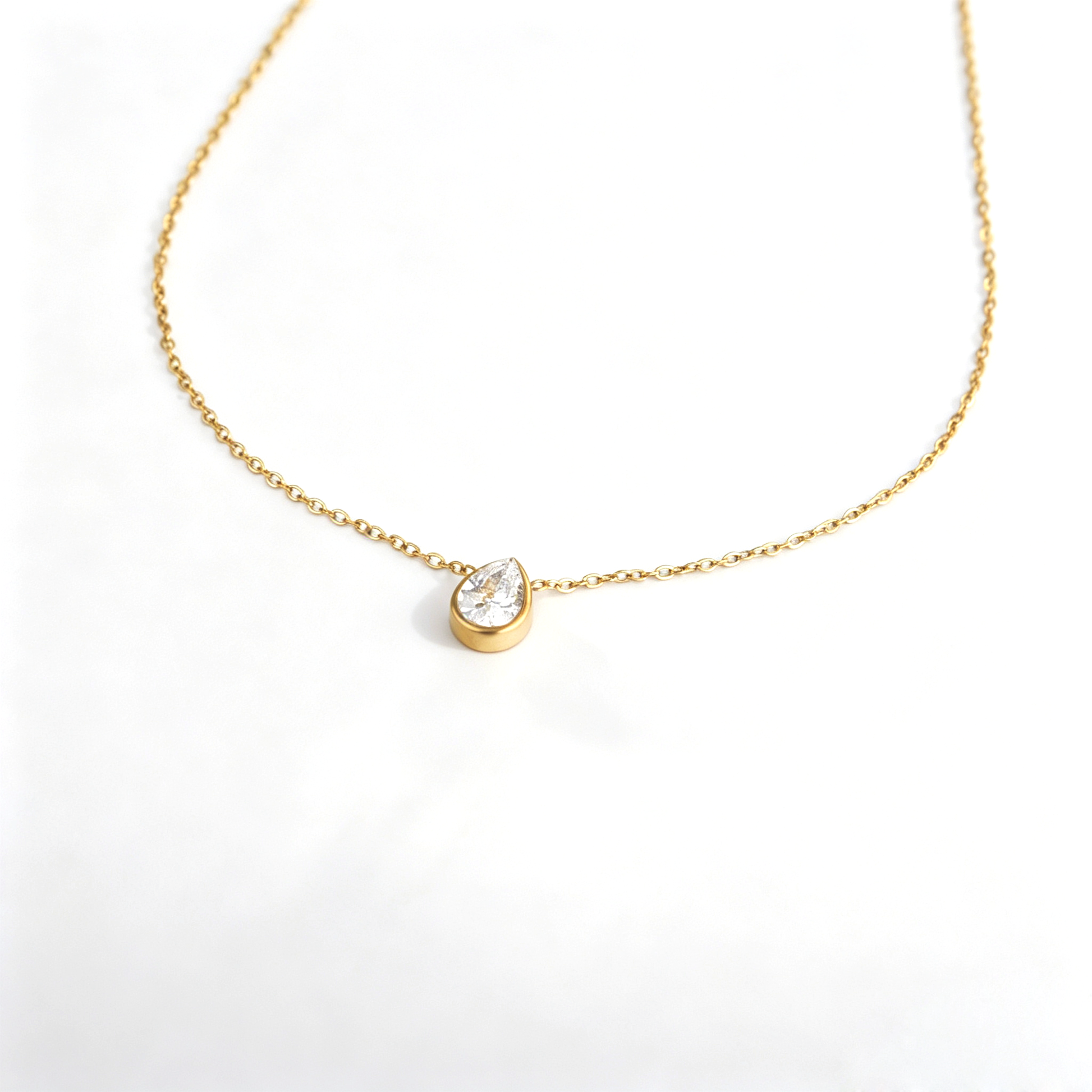Stainless steel lobster clasp, extender chain, and engraved S.steel tag on 18K gold necklace
