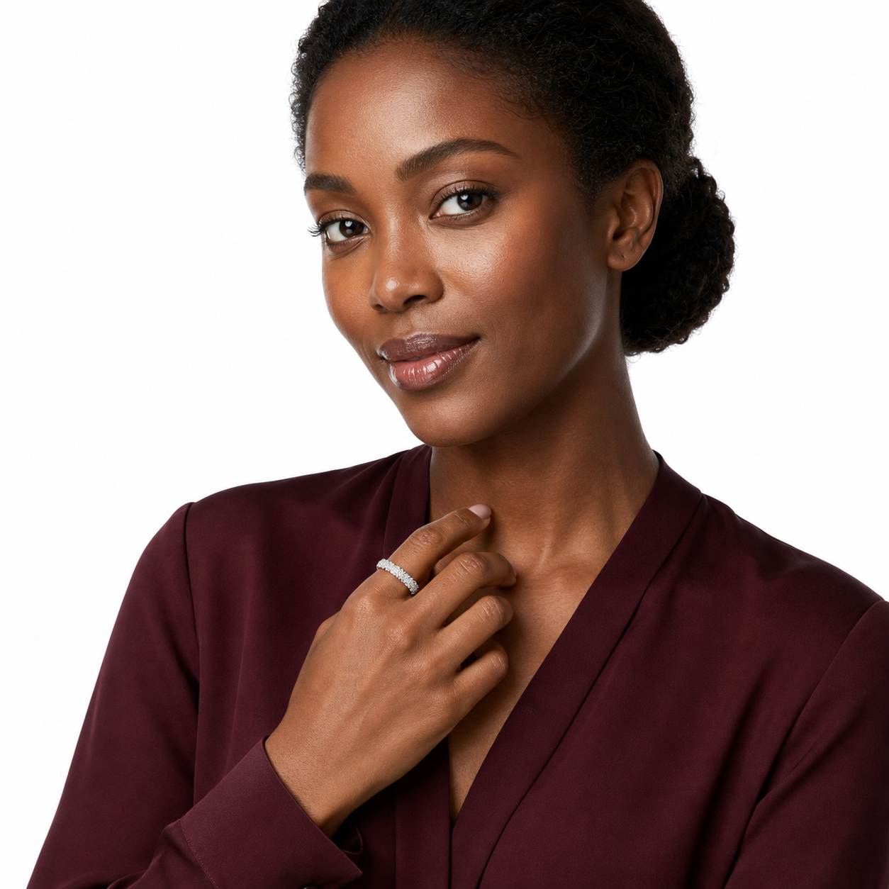 Black woman in a burgundy blouse wearing a sparkling silver-tone pavé cubic zirconia open band ring.