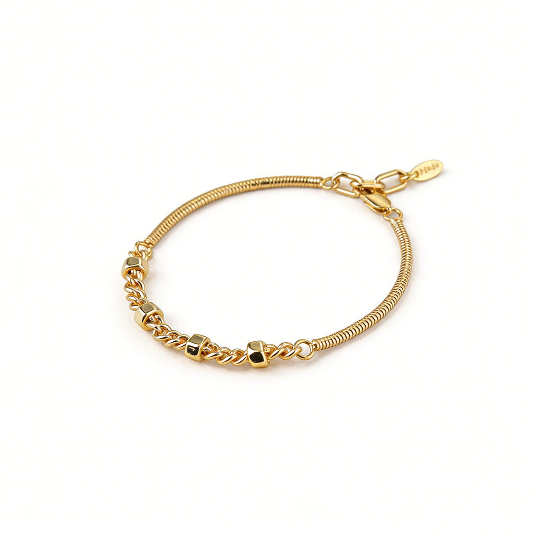 Secure spring clasp and 2cm extension chain on an adjustable 17.5+2.5cm gold snake chain bracelet.