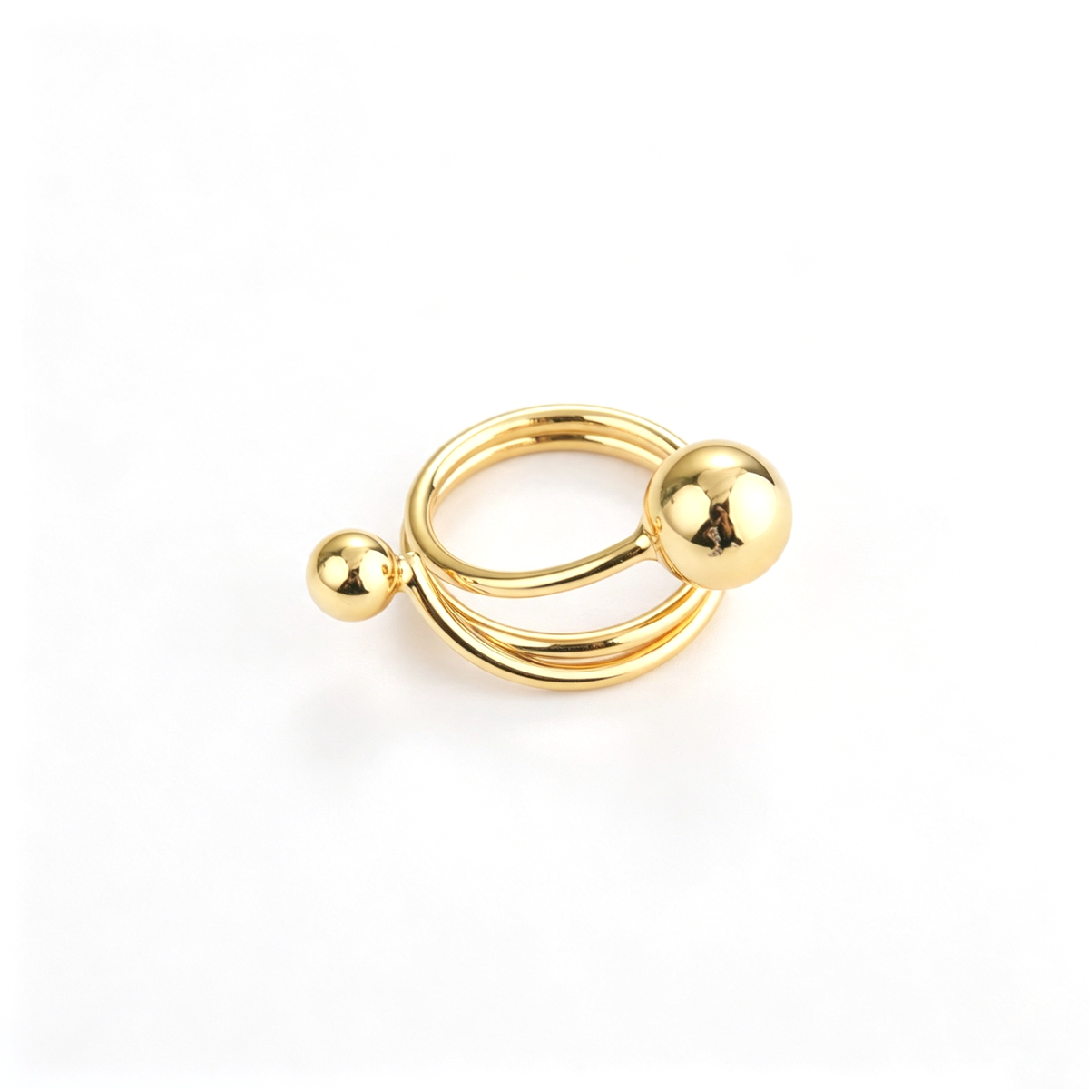 Ball accent open cuff ring shown from a front view with curved bands