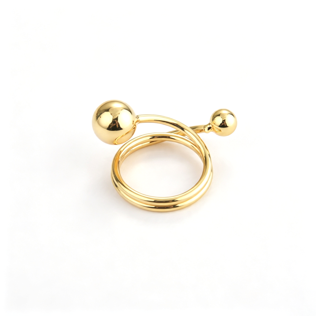 Ball accent cuff ring shown from a three-quarter view with its sculptural rounded details