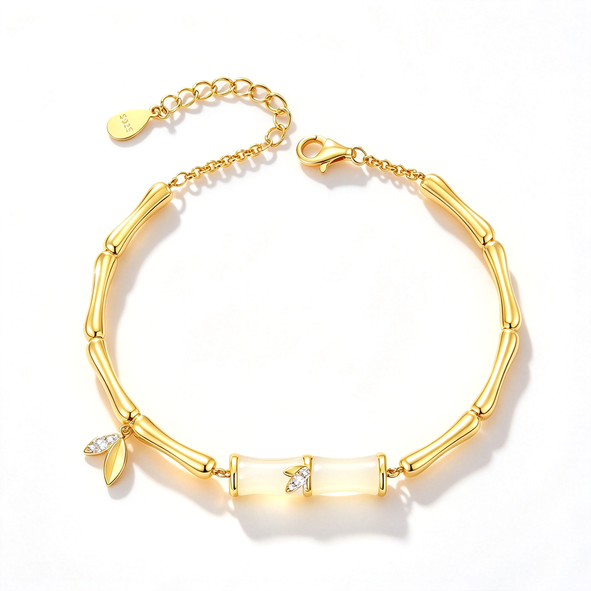 Bamboo-inspired charm bracelet with linked segments and decorative leaf accents shown in a full overhead view.