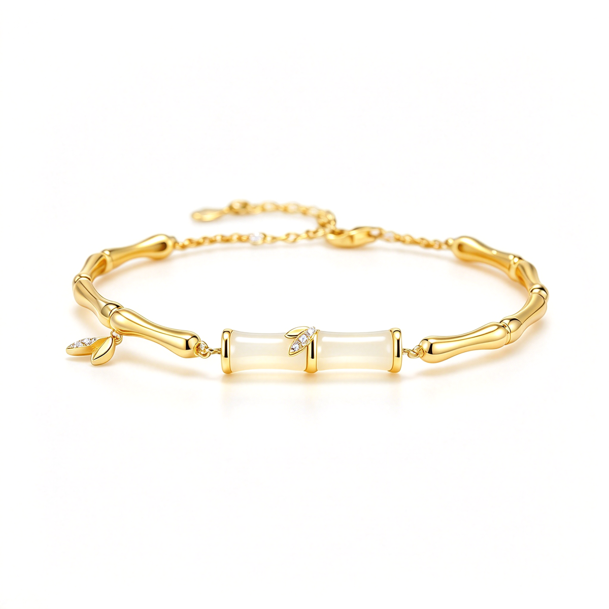 Gold-tone bamboo-style bracelet displayed from the front with two central segments and small leaf charms.