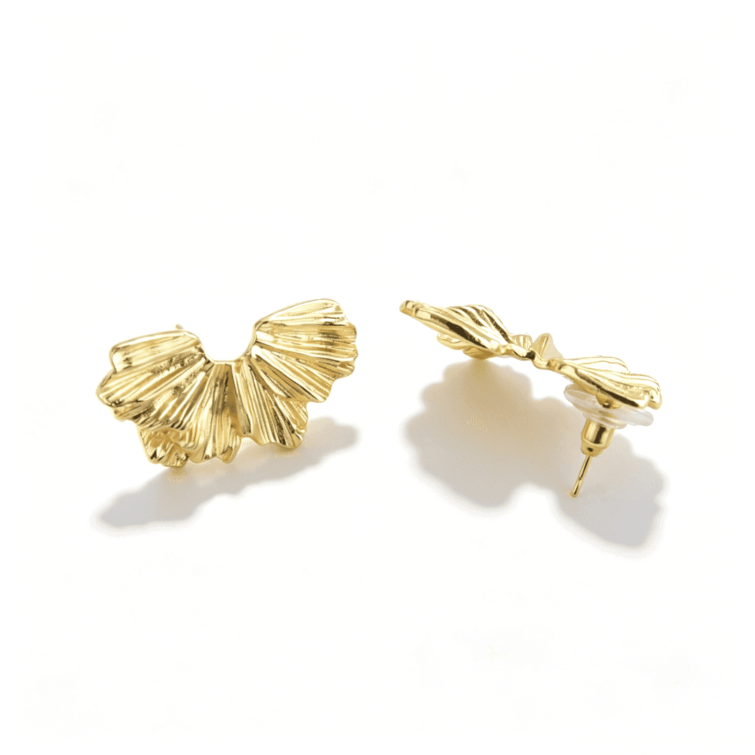 Ever P. big gold hoop earrings with a geometric hollow teardrop design for a quiet luxury aesthetic.