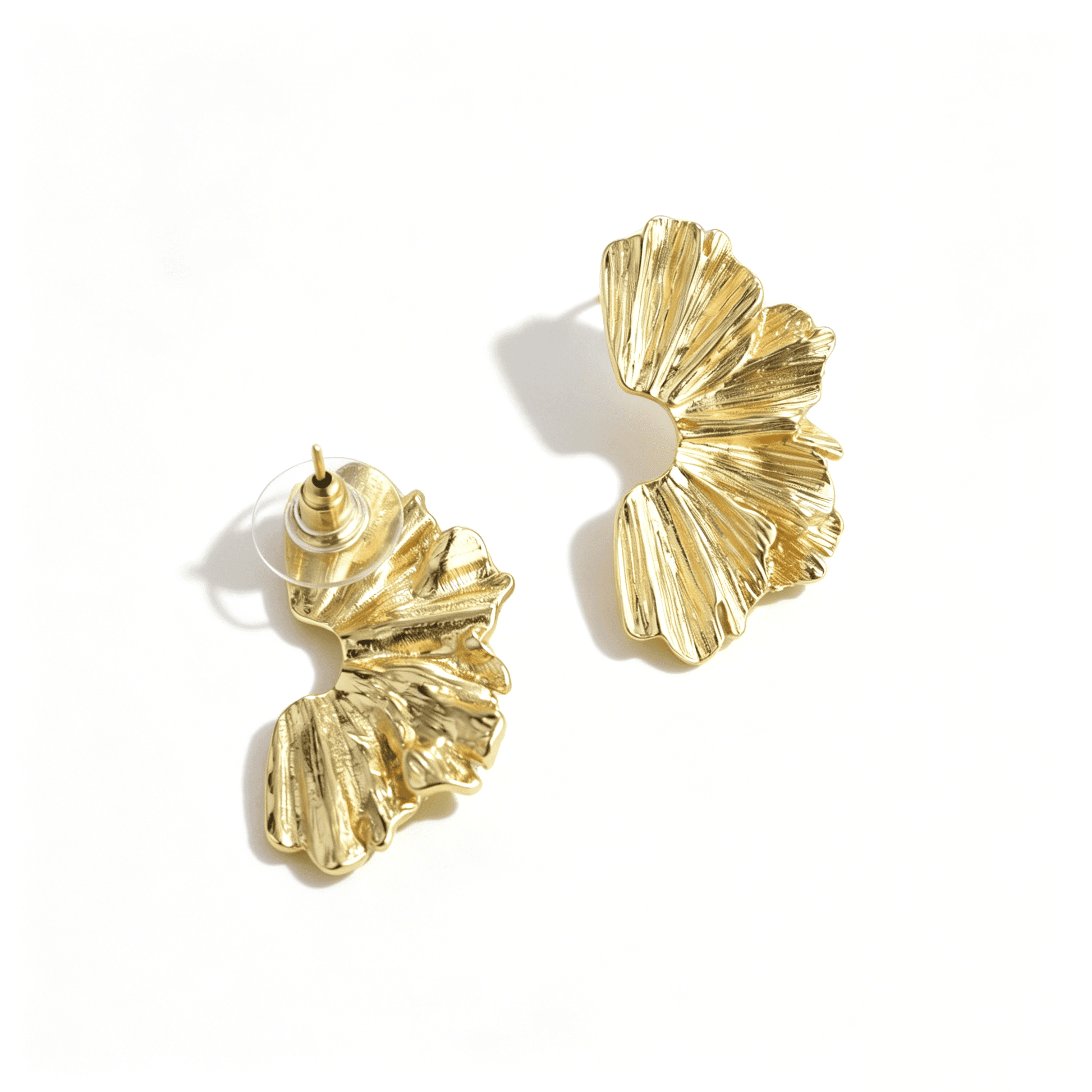 Detailed view of 18k gold plated earrings by Ever P. showing the high-polish finish.