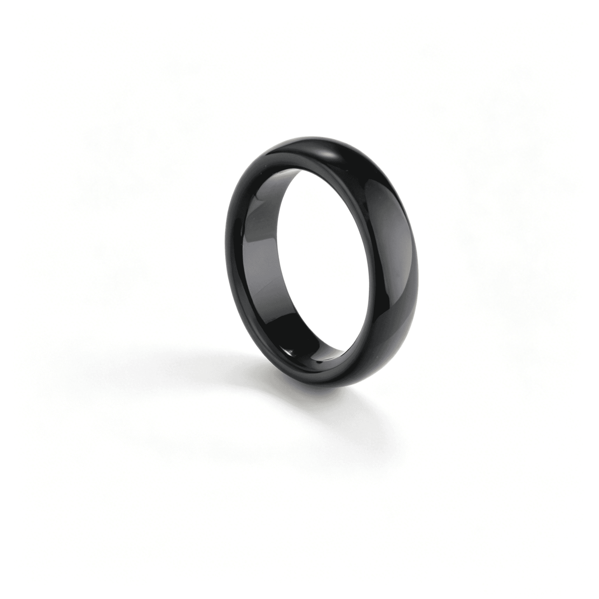 A natural black chalcedony ring by Ever P., featuring a sleek obsidian-like onyx agate band with a high-gloss finish.